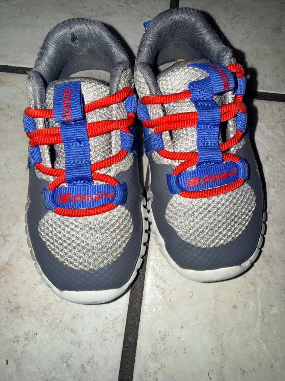 New Balance Kids Gray Sneakers with Blue & Red Details